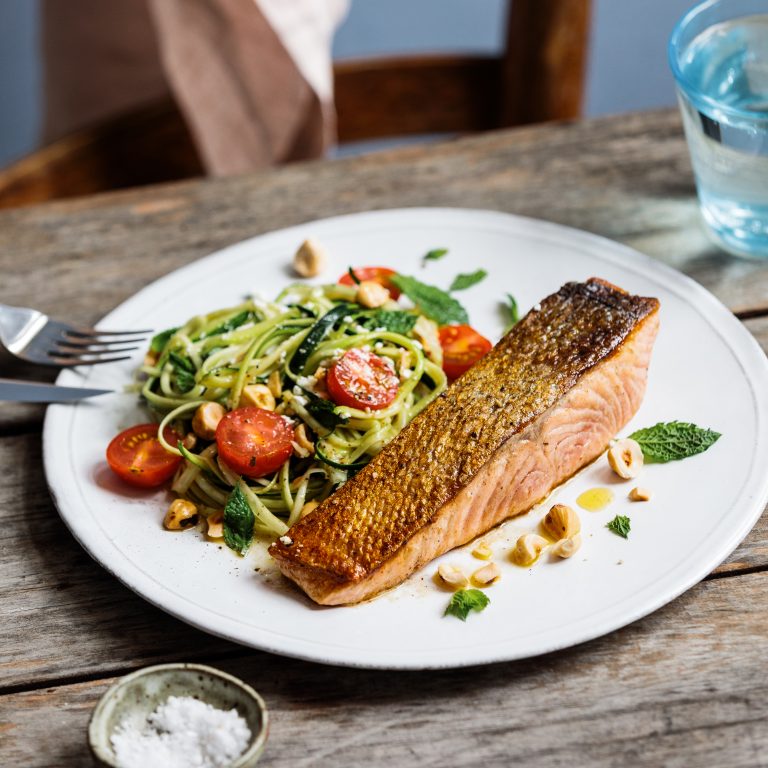 Seared Huon Salmon with zucchini noodles (zoodles), mint and hazelnuts